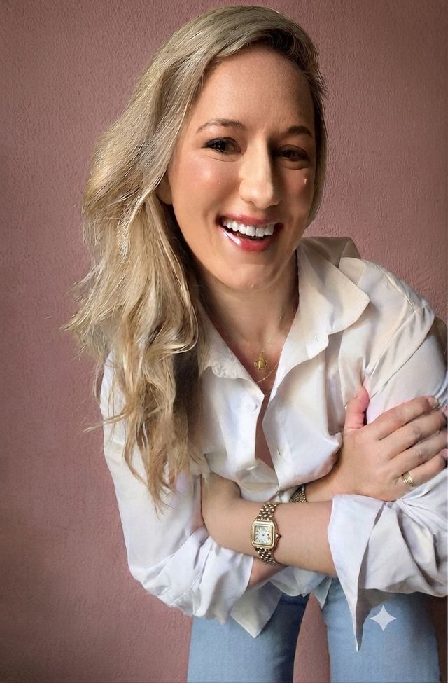 Esmarie Swanepoel, smiling, in a white shirt